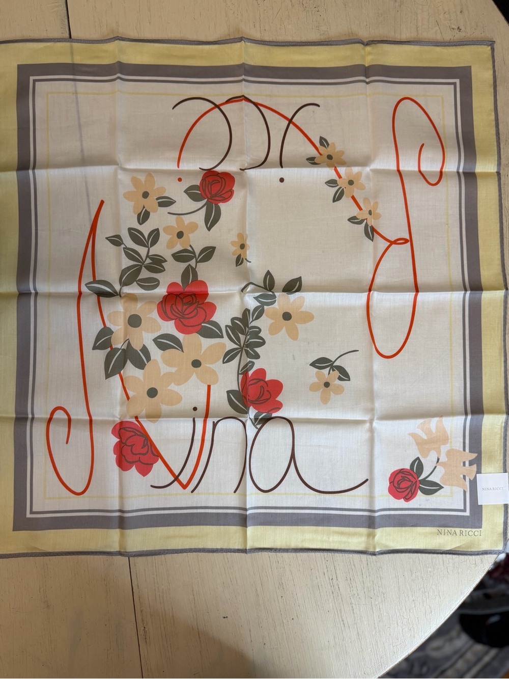 NWOT Nina Ricci 22” Square Cream Scarf with Red Floral Motif and Yellow Border